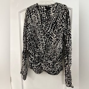 Rachael Zoe longsleeved 100% silk top. Black and white print. Size 8.